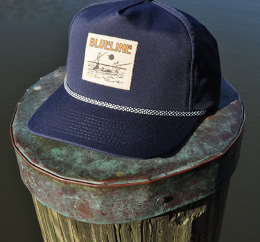 Blueline Skiff rope hat in twilight navy photographed along the Intracoastal in Jupiter Florida