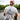 Man wearing a washed white Blueline Triangle Lighthouse T-shirt with navy graphic on the back, standing on a dock near the water in Jupiter, Florida.