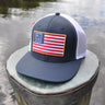 Blueline USA Flag Performance Hat in Navy and White featuring an American flag patch and lightweight performance construction.
