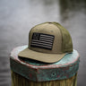 Blueline USA Flag Performance Hat in Olive featuring a blacked-out American flag patch and lightweight performance construction.