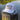 Blueline USA Flag Performance Hat in White and Charcoal featuring a tonal embroidered American flag patch with breathable perforated side panels.
