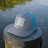 Blueline Vintage Circle Performance Hat in Cityscape and Aqua featuring a Vintage Circle patch with breathable perforated side panels.