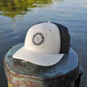 Blueline Vintage Circle Performance Hat in Stone and Navy featuring the Vintage Circle patch with breathable perforated side panels.
