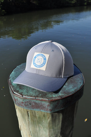 Blueline vintage circle patch trucker hat in CityScape grey with stone mesh photographed in Jupiter Florida