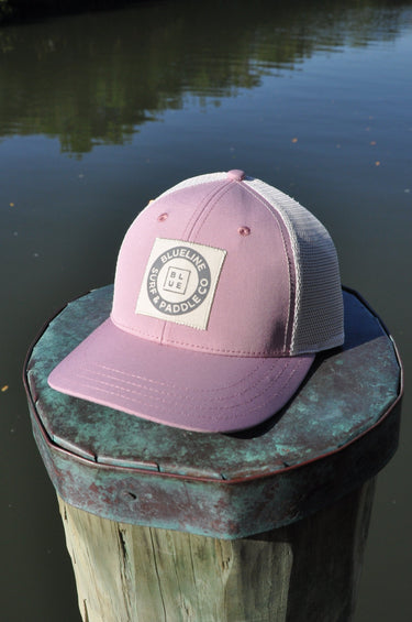 Blueline vintage circle patch trucker hat in dried rose with stone mesh photographed in Jupiter Florid