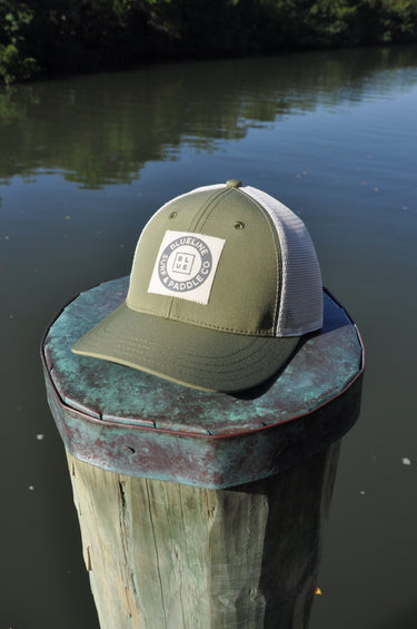 Blueline vintage circle patch trucker hat in oregano green with stone mesh photographed in Jupiter Florida