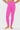 Bright pink leggings worn by a person on a white background
