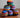 Colorful woven hacky sacks from Blueline Surf & Paddle Co. featuring assorted random patterns and coastal-inspired designs for beach days, travel, and outdoor fun.