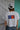 Back view of white FL Box crop t-shirt with blue and orange Florida Box logo
