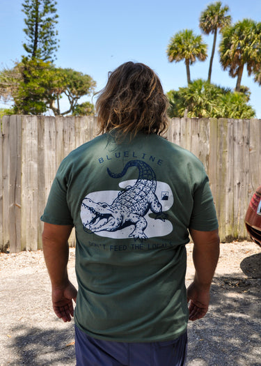 Back view of green FLOMO x BL Gator T-Shirt featuring vintage-inspired alligator artwork inspired by Florida wildlife, boating, and coastal living.