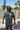 Front view of green FLOMO x BL Gator T-Shirt from Blueline Surf & Paddle Co. featuring soft lightweight coastal lifestyle styling.