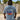 Front view of FLOMO x BL Wave T-Shirt in blue from Blueline Surf & Paddle Co. featuring lightweight coastal lifestyle styling inspired by surfing, boating, and Florida beach culture.