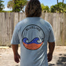 Front view of FLOMO x BL Wave T-Shirt in blue from Blueline Surf & Paddle Co. featuring lightweight coastal lifestyle styling inspired by surfing, boating, and Florida beach culture.