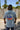 Front view of FLOMO x BL Wave T-Shirt in blue from Blueline Surf & Paddle Co. featuring lightweight coastal lifestyle styling inspired by surfing, boating, and Florida beach culture.
