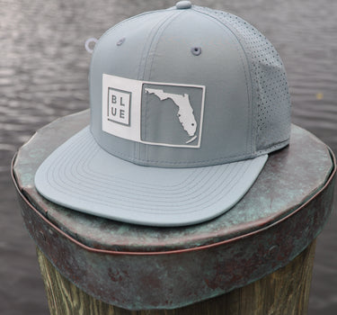 Florida Box UV Hat in quarry gray with white logo by Blueline Surf & Paddle Co., featuring BL/UE Florida patch on breathable snapback performance hat.