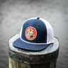 Florida Seal Performance Hat in navy and white featuring the Blueline Florida Seal patch and lightweight UV Lite performance construction.