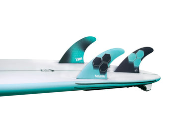 Futures AM1 Honeycomb Thruster Medium fins installed in a surfboard