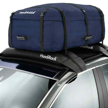 Land Rover Discovery SUV with a large cargo storage bag securely attached to the HandiRack inflatable crossbars