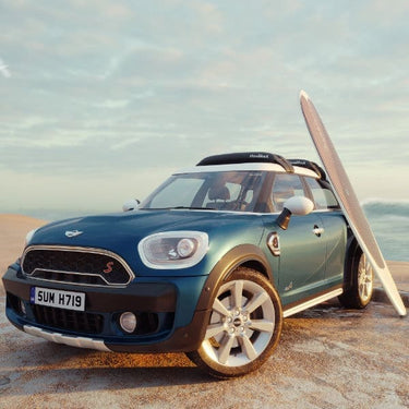 HandiRack universal roof rack with paddleboard and surfboard loaded on a Mini Cooper near the Jupiter Florida beach
