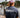 Man at Blueline Surf and Paddle dock wearing a Blueline Jupiter T-shirt in heather navy.
