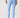 A person shown from the back wearing light blue high-waisted leggings with a small side cutout near the ankle.