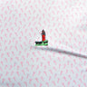 Close up of Johnnie-O x Blueline Marina Polo in Punch showing the print and lighthouse logo