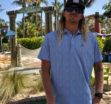Johnnie-O × Blueline Prawn Polo Kona blue performance golf polo inspired by the Jupiter Florida coastal lifestyle