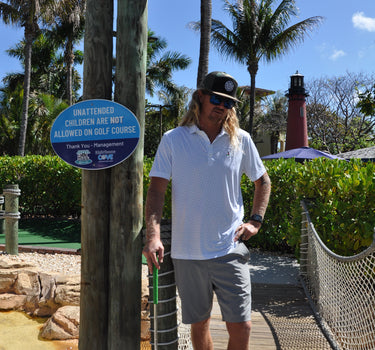 Johnnie-O × Blueline Tini Dancer Polo White performance golf polo in Jupiter Florida coastal lifestyle setting
