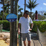 Johnnie-O × Blueline Tini Dancer Polo White performance golf polo in Jupiter Florida coastal lifestyle setting