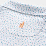 Close up of Johnnie-O Tini Dancer martini print performance polo fabric