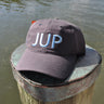 JUP Cotton Twill Hat Navy/Carolina with bold JUP lettering on dock in Jupiter Florida