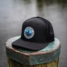 Jupiter Lighthouse Performance Hat in black featuring a premium Jupiter Lighthouse patch and lightweight UV Lite performance construction.