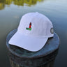 White Jupiter Lighthouse Strapback Hat from Blueline Surf & Paddle Co. featuring embroidered lighthouse artwork and relaxed coastal styling inspired by the Jupiter Florida lifestyle.