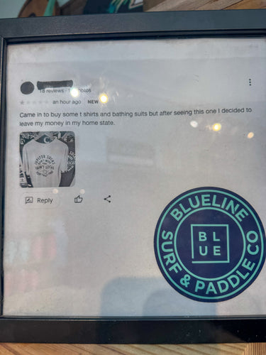 Customer 1-star review about the Jupiter Sucks Don’t Move Here shirt at Blueline Surf and Paddle surf shop in Jupiter Florida