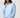 A woman modeling a light blue long-sleeve cropped hoodie.