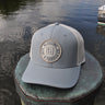 OG Blueline Logo Canvas Hat Quarry/Stone with classic Blueline patch on dock – coastal mesh hat