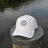 OG Blueline Logo Cotton Twill White Hat displayed on dock by the water