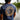 Back view of a navy heather Blueline OG logo T-shirt with large coral circle logo, photographed outdoors in Jupiter, Florida.