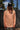 Person wearing coral OG Logo Hooded UV Sun Shirt from Blueline Surf & Paddle Co. designed for sun protection, fishing, boating, paddling, and coastal outdoor adventures in Jupiter Florida.