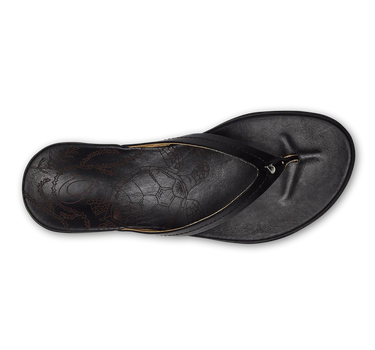 OluKai Honu women's leather sandals in Black featuring premium leather straps, anatomical footbed, and durable rubber outsole for everyday coastal living.