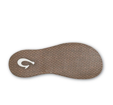 Durable non-marking rubber outsole on the OluKai Paniolo women's sandals designed for lasting comfort and dependable traction.