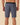 men wearing Outerknown Apex Evolution boardshorts back view surf and beach fit