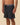 men wearing Outerknown scallop boardshorts front view surf and beach style