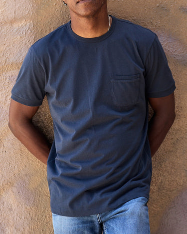 man wearing navy Outerknown Sojourn pocket tee casual everyday t-shirt