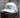 White cap with a colorful logo on a wooden post