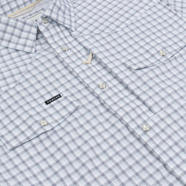 Close-up of navy and blue plaid fabric on Poncho Blackfin shirt