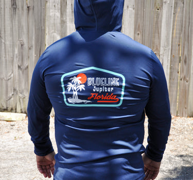 Back view of Rectangle Palm Hooded UV Sun Shirt Navy from Blueline Surf & Paddle Co. featuring palm-inspired coastal artwork and lightweight sun protection performance fabric.