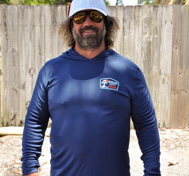 Front view of Rectangle Palm Hooded UV Sun Shirt Navy from Blueline Surf & Paddle Co. featuring lightweight UPF performance fabric designed for fishing, boating, and the Jupiter Florida coastal lifestyle.