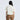 Person wearing a patterned shirt and brown pants on a white background