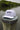 Blueline Rod & Reel Trucker Hat in white and black with vintage fishing patch and breathable mesh back.